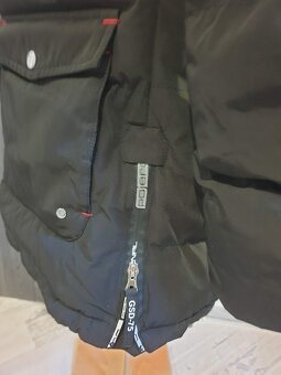 Krásná delší zimní bunda na hory - 11