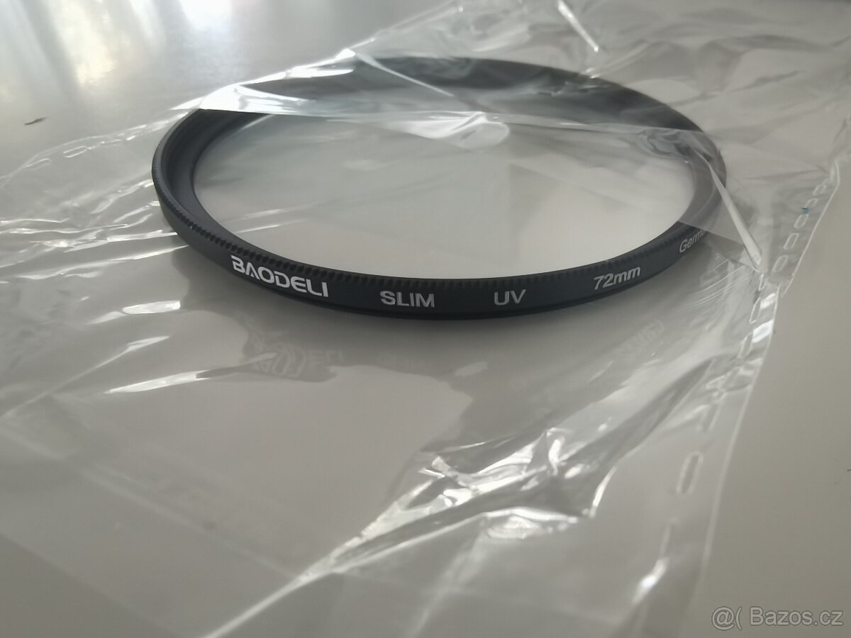 Krytka objektivu, popruh, clona, difuzer, očnice.. - 12