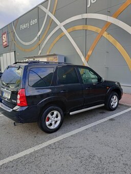Mazda tribute 2.3 i    4×4 - 12