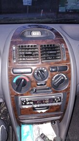 Carisma 1.6 benzín 66kw,rok98 - 12