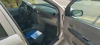PRODÁM MAZDA 2, 1.2 BENZÍN, velmi pěkný stav, klima, nové pn - 12