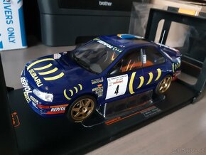 Subaru, Opel, Fiat a Ford    1:18   IXO - 12