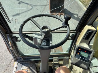 Kolové rypadlo / nakladač New Holland MH CITY - 13