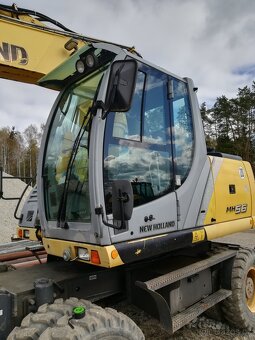 Prodám kolový bagr New Holland MH 5.6, 20,5 t, r.v. 2009, 8. - 13