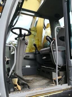 Prodám kolový bagr New Holland MH 5.6, 20,5 t, r.v. 2009, 8. - 15
