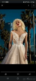 Prodám svatební šaty cena dohodou - 17