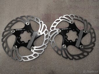 Spousta nových brzdových kotoučů 6 děr a CL. - 17