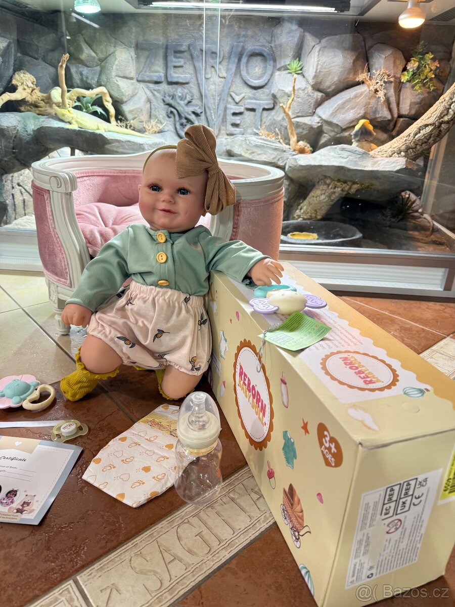 Realistická Reborm panenka s čelenkou a příslušenstvím - 18