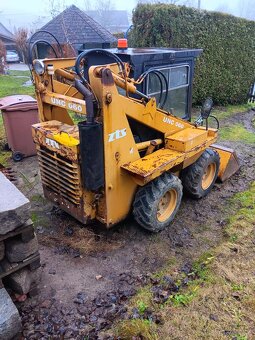 Smykový nakladač unc 060+podkop+vidle