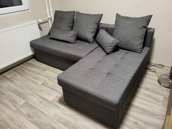 Šedá rozkládací pohovka