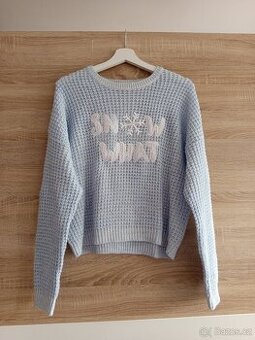 Svetr se zimním motivem