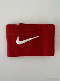 Nike úchyt, páska na chrániče
