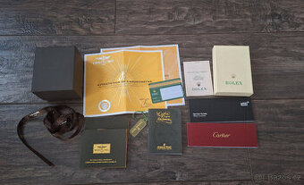 Krabice, servisné knižky + certifikáty ROLEX, Breitling....