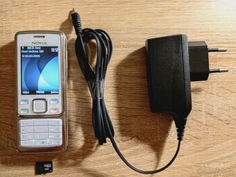 Nokia 6300 + nabíječka a 2GB SD karta
