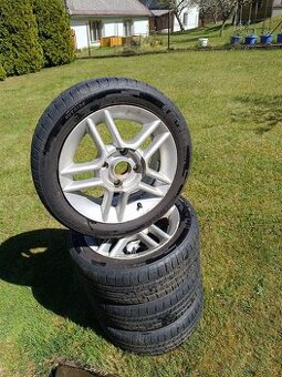 Suzuki Swift alu disky Mangels 4x114.3 14 pneu 185/50 R14