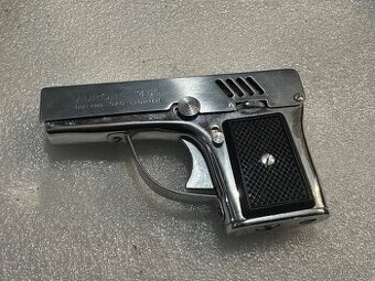 Prodám starý, plně funkční zapalovač s bleskem “pistolka”