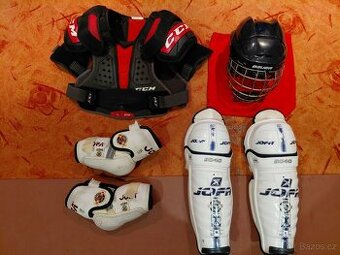 Chrániče ramen CCM, helma Bauer, loketní a holenní chrániče