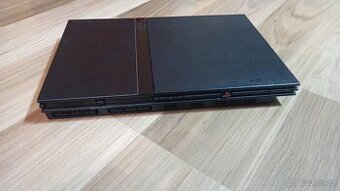 2× PS2 Slim (nefunkční) + volant + 3 ovladače + hry