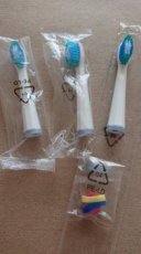 Remington, náhradní zubní kartáčky.