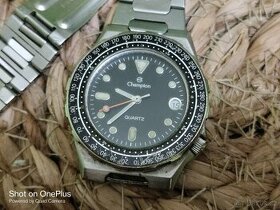 Staré hodinky Champion Quartz Manaus s datumovkou,cca 1980