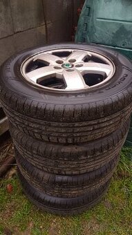 ALU kola 5x100 57,1 mm s pneu 195/65/R15 letní Dot 2023