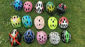 Prodám různé cyklistické helmy horní řada modrá (v zadu pras