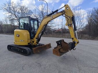 Bagr Caterpillar 303.5. + hydraulická svahovačka.