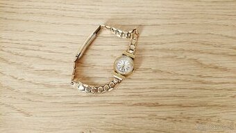 Dámké zlaté hodinky Tissot