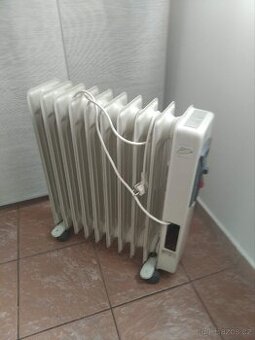 Prodám použitý olejový radiátor