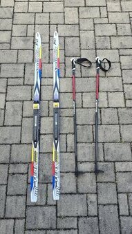 Běžecké lyže s vázáním a hůlkami Salomon vel. 141