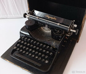 Kufříkový psací stroj OLYMPIA - 1