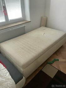 Postel v bílé barvě 120 cm s úložným v dobrém stavu.