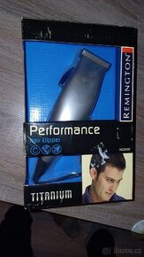 Stříhací holící strojek Remington