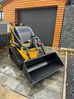 Mininakladač pásový, Smykový- široké pásy