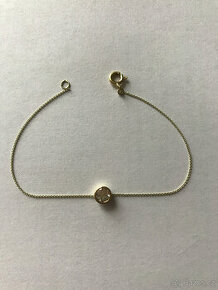 Zlatý náramek s topazem