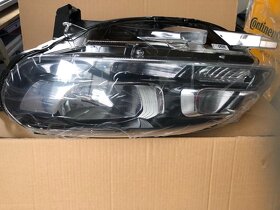 nový ORIGINAL přední světlomet Levý -NOVA CENA
