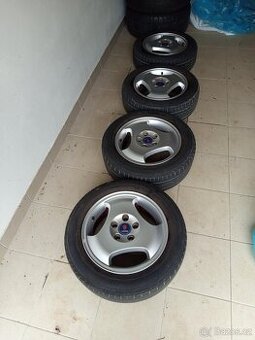 4 originální R15 Alu disky s pneu na Saab 900, Saab 9-3