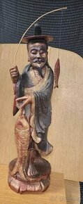 Japonská dřevěná socha rybáře