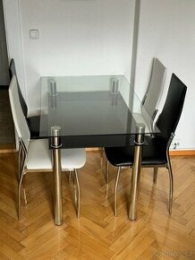 Skleněný jídelní stůl a 4ks koženkových židlí