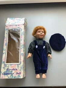Stará porcelánová figurka-hračka