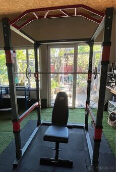 Domácí posilovna - klec, lavice, činky, kotouče, osy