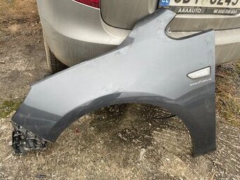 Blatník Opel Astra levý přední rok 2012