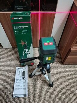 Křižový liniový laser se stativem krabice a návod CZ