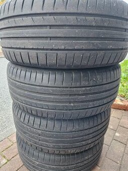 Letní pneu Dunlop, komplet kola plech Octavia, poklice Škoda