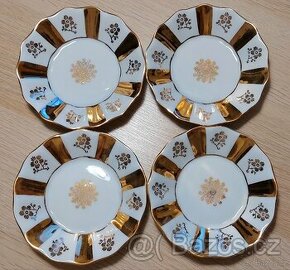 Set čtyř porcelánových podšálků se zlacením Lesov