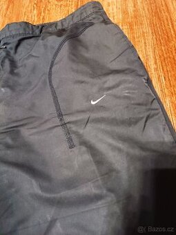 dámské šusťákové kalhoty Nike