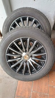 Prodám 4ks Alu kol na Ford Fiesta, obuté na letních pneu.
