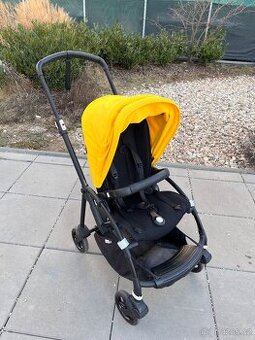 Bugaboo Bee6 All Black se žlutou prodlužovací stříškou s prů