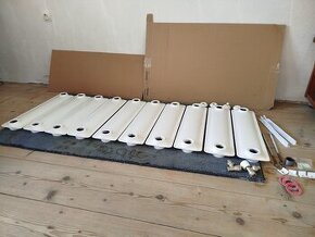 Litinový radiátor.