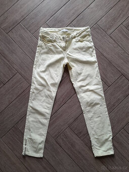 Pastelově žluté rifle zn. Promod, vel. 36